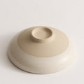 Sesame glazed ceramic conical bowl smooth interior top down view

