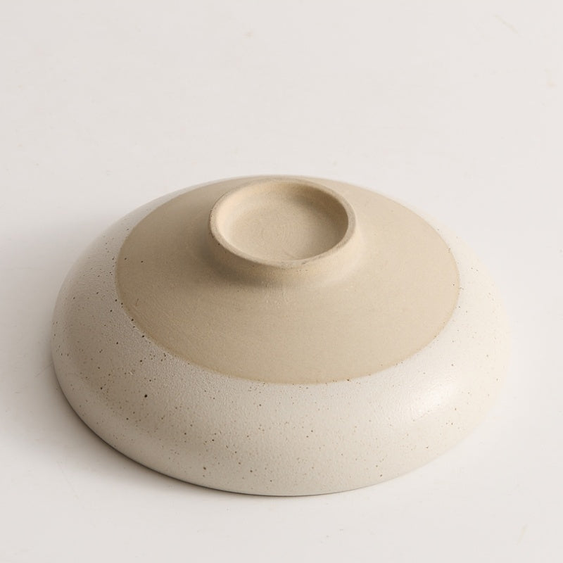 Sesame glazed ceramic conical bowl smooth interior top down view
