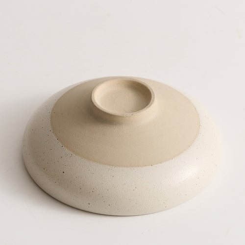 Sesame glazed ceramic conical bowl smooth interior top down view
